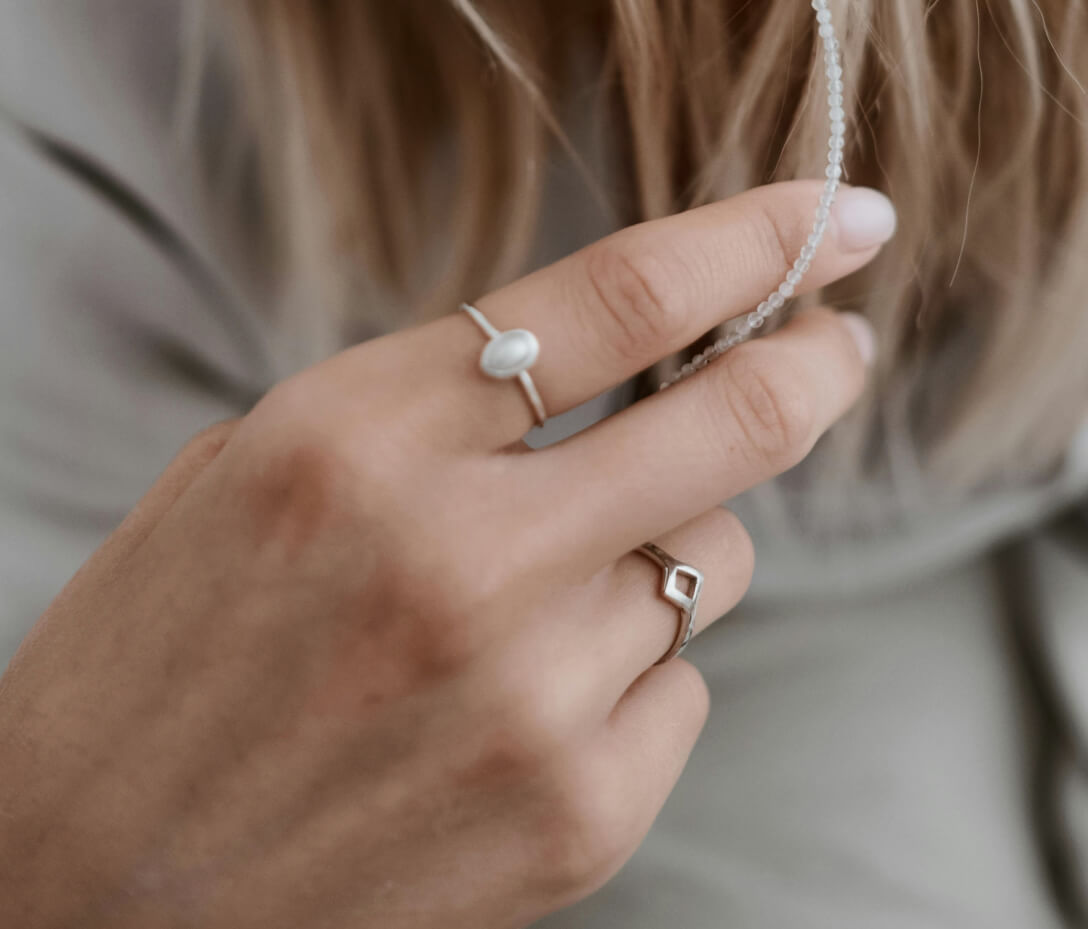 Sterling silver moonstone solitaire ring and a diamond shaped band